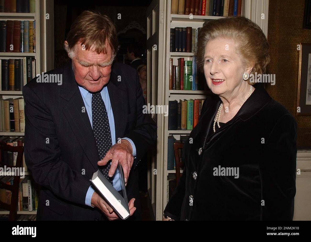 File photo dated 24/03/03 of Sir Bernard Ingham with former Prime Minister Baroness Thatcher, at the reception to mark the launch of his book The wages of spin, at his publishers in central London. Sir Bernard Ingham, the long-serving press secretary for Margaret Thatcher, has died aged 90 after a short illness, his family have said. Stock Photo