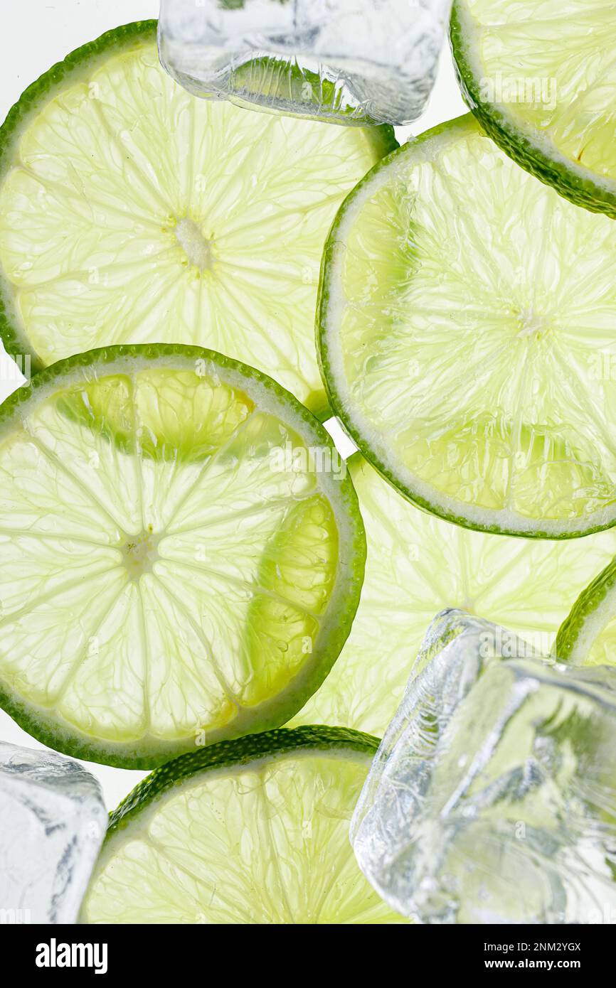 Slices Limes with ice cubes Stock Photo
