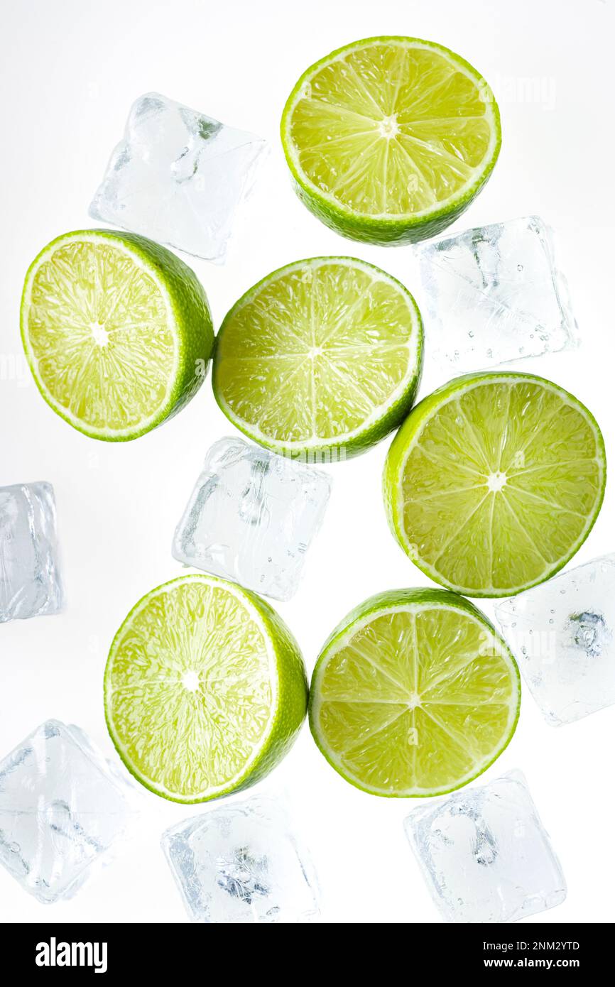 Slices Limes with ice cubes Stock Photo