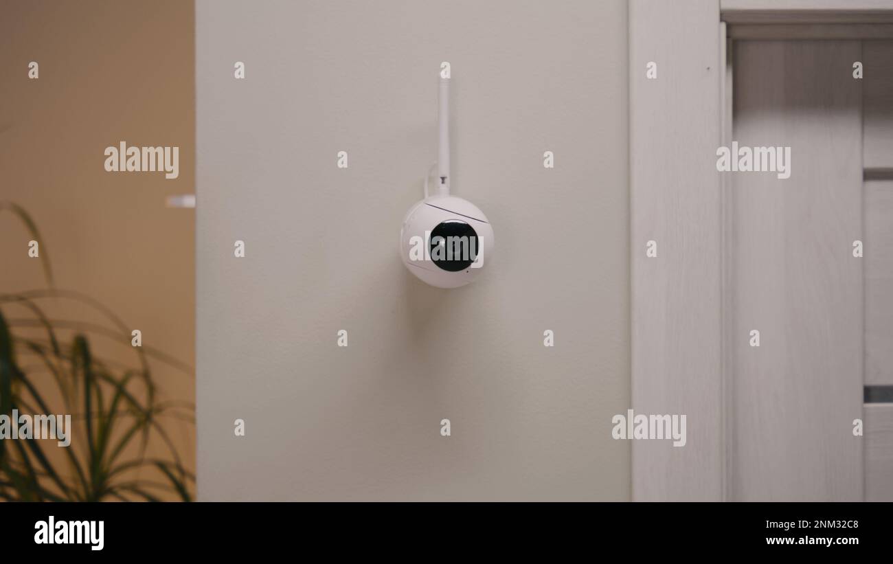 Installed security camera on the wall in the modern apartment. CCTV