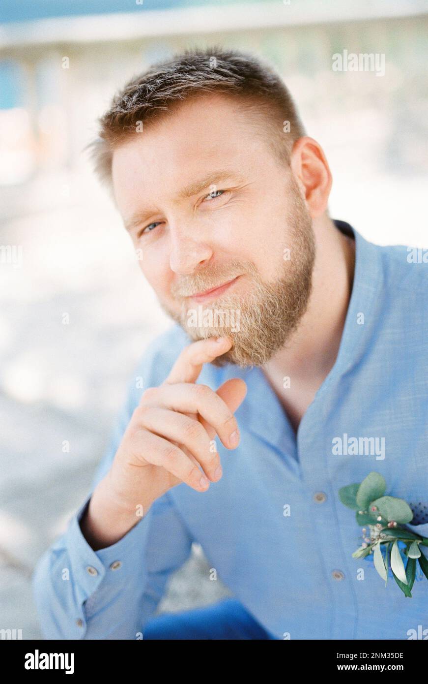 Man touching chin fingers hi-res stock photography and images - Alamy