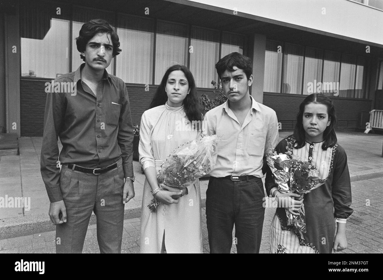 Four young Afghan refugees arrived at Schiphol from left to right. Galledda (13 years old), Hammid (16 years old), Weida (21 years old) and Daout (18 years old) ca. 1985 Stock Photo