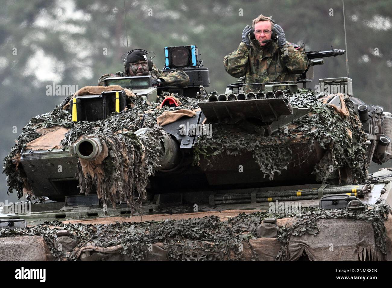 Augustdorf, Germany. 01st Feb, 2023. Boris Pistorius (SPD, r), Minister of Defense, rides in the turret of a Leopard 2A6 with a soldier from the Bundeswehr's Tank Battalion 203. Germany is delivering four more Leopard 2A6 main battle tanks from Bundeswehr stocks to Ukraine. 'Germany thus increases its delivery number from 14 to 18 tanks,' the Defense Ministry announced Friday in Berlin. Credit: Federico Gambarini/dpa/Alamy Live News Stock Photo