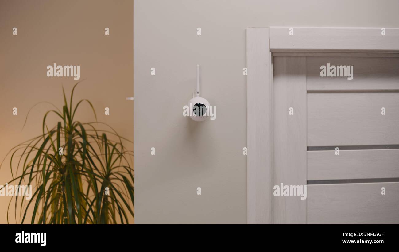 Installed security camera on the wall in the modern apartment. CCTV