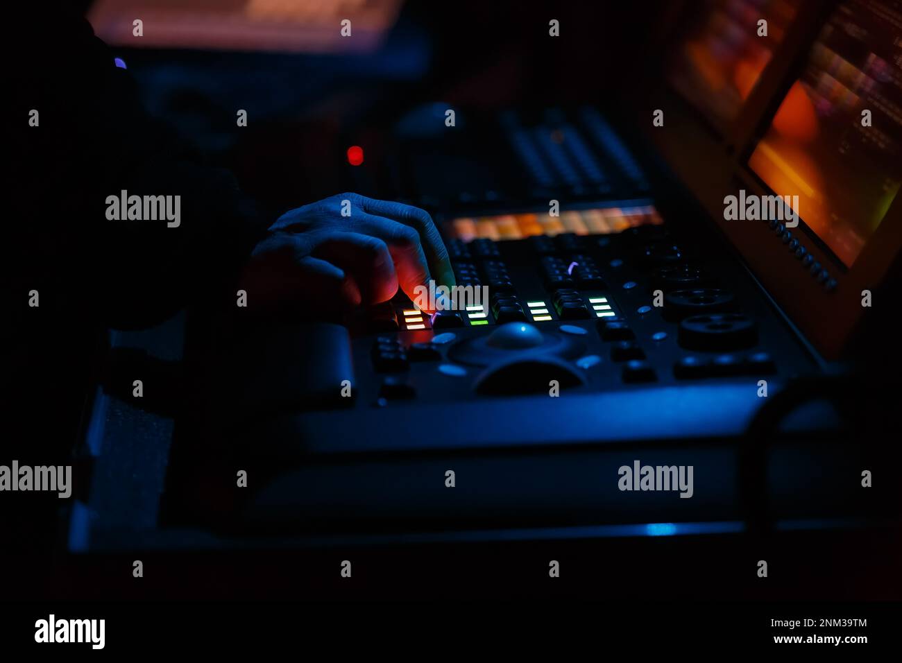 Stage lighting technician working on concert. Professional lights