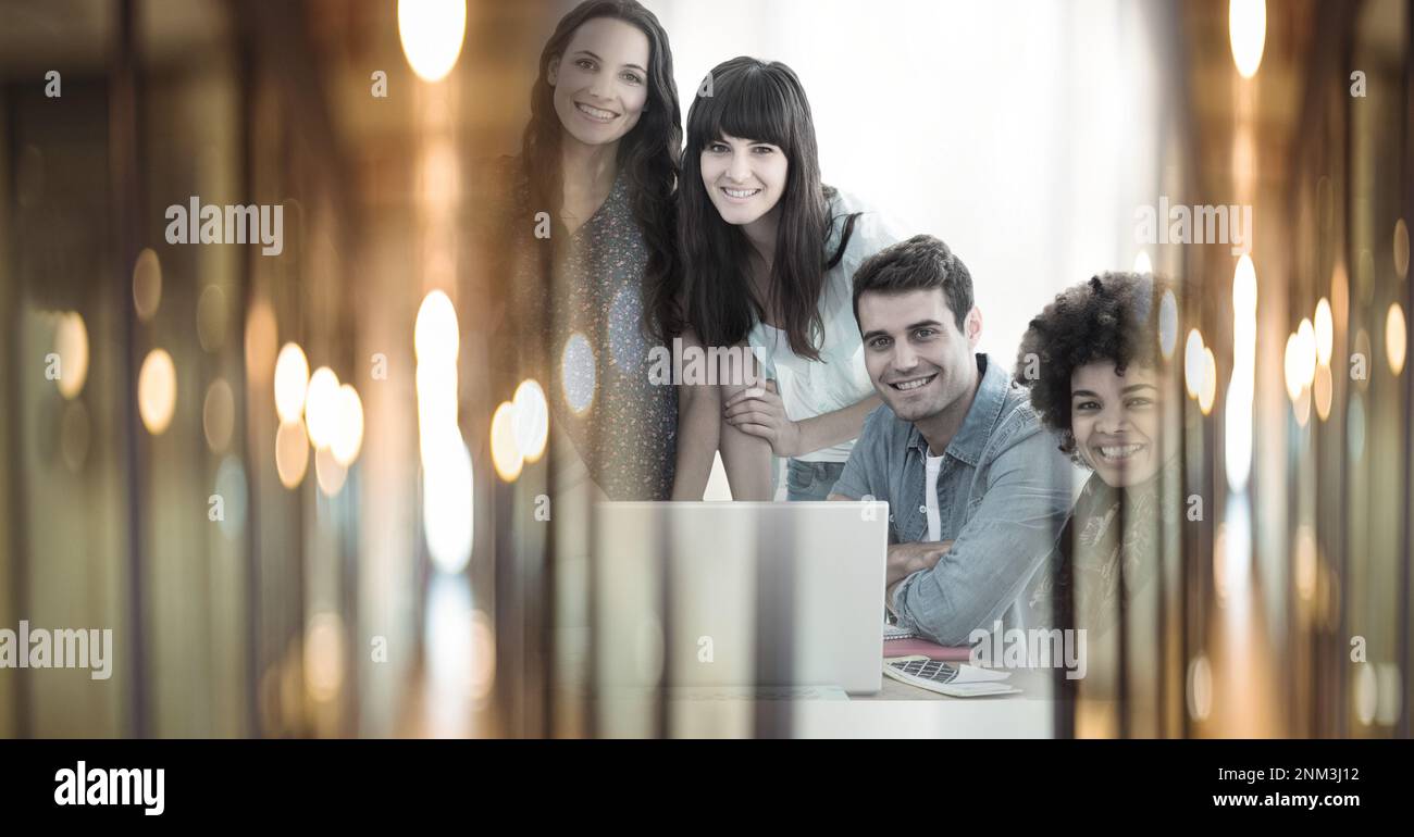 Composition of happy diverse business team using laptop with double ...