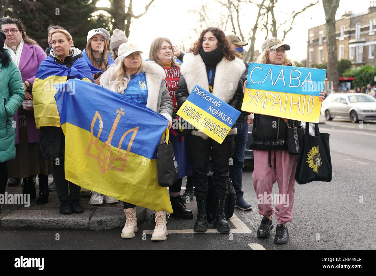 People gather next to the St. Volodymyr Statue in Holland Park, London