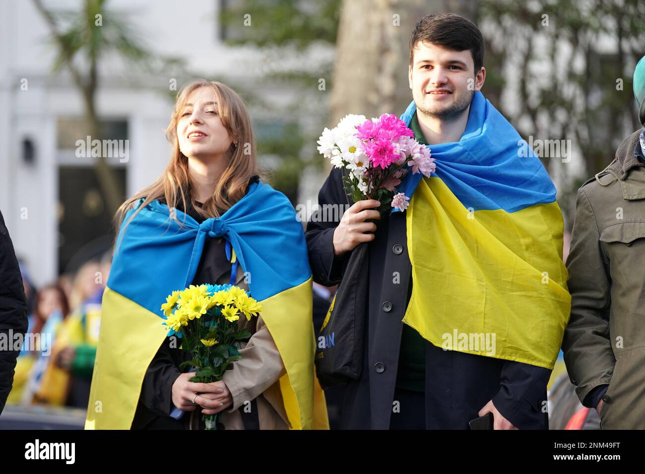 People gather next to the St. Volodymyr Statue in Holland Park, London