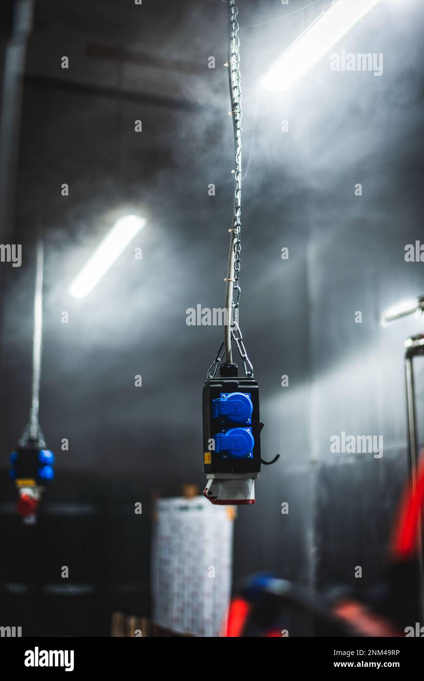 Industrial socket outlets hanging from the ceiling Stock Photo Alamy
