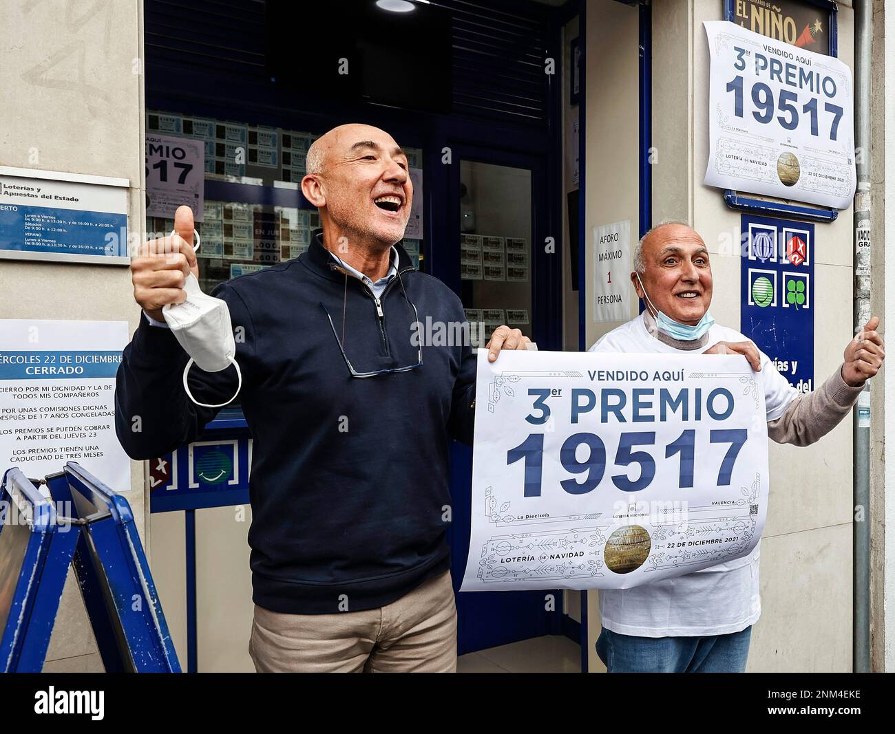 two-employees-of-the-administration-located-in-jativa-street-in-valencia-celebrate-that-they-have-sold-part-of-the-number-19517-corresponding-to-the-second-prize-of-the-extraordinary-draw-of-the-christmas-lottery-december-22-2021-in-valencia-valencian-community-spain-this-years-draw-has-distributed-2021-a-total-of-2408-million-euros-in-prizes-the-same-amount-as-the-previous-year-among-the-prizes-distributed-by-the-christmas-lottery-highlights-the-popularly-known-as-gordo-christmas-the-first-prize-of-400000-euros-per-tenth-the-second-prize-is-125000-euros-per-tenth-22-december-2NM4EKE.jpg
