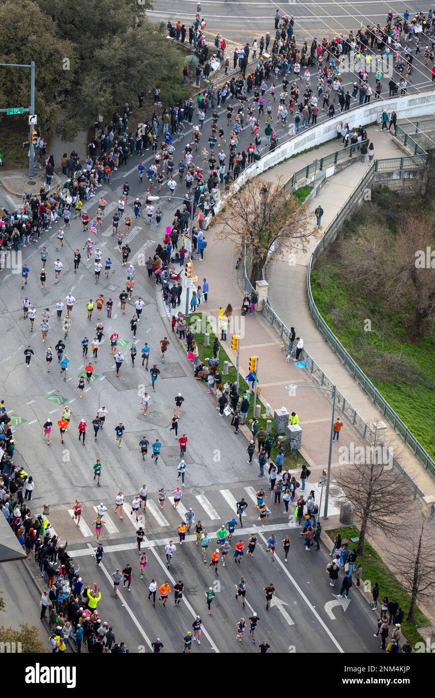 Austin Marathon runners coming off First Ave Bridge in Texas Stock