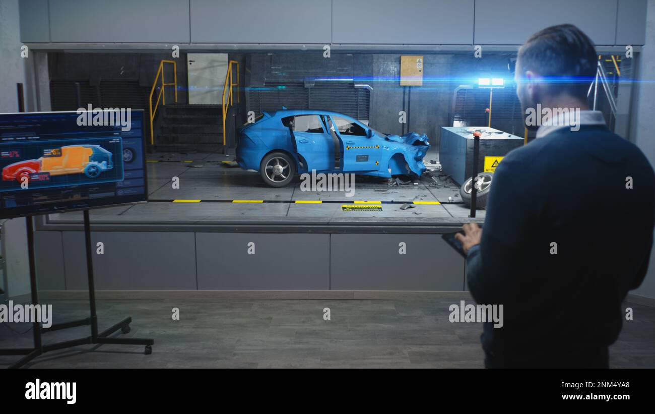 Male engineer simulates and watches process of traffic accident using