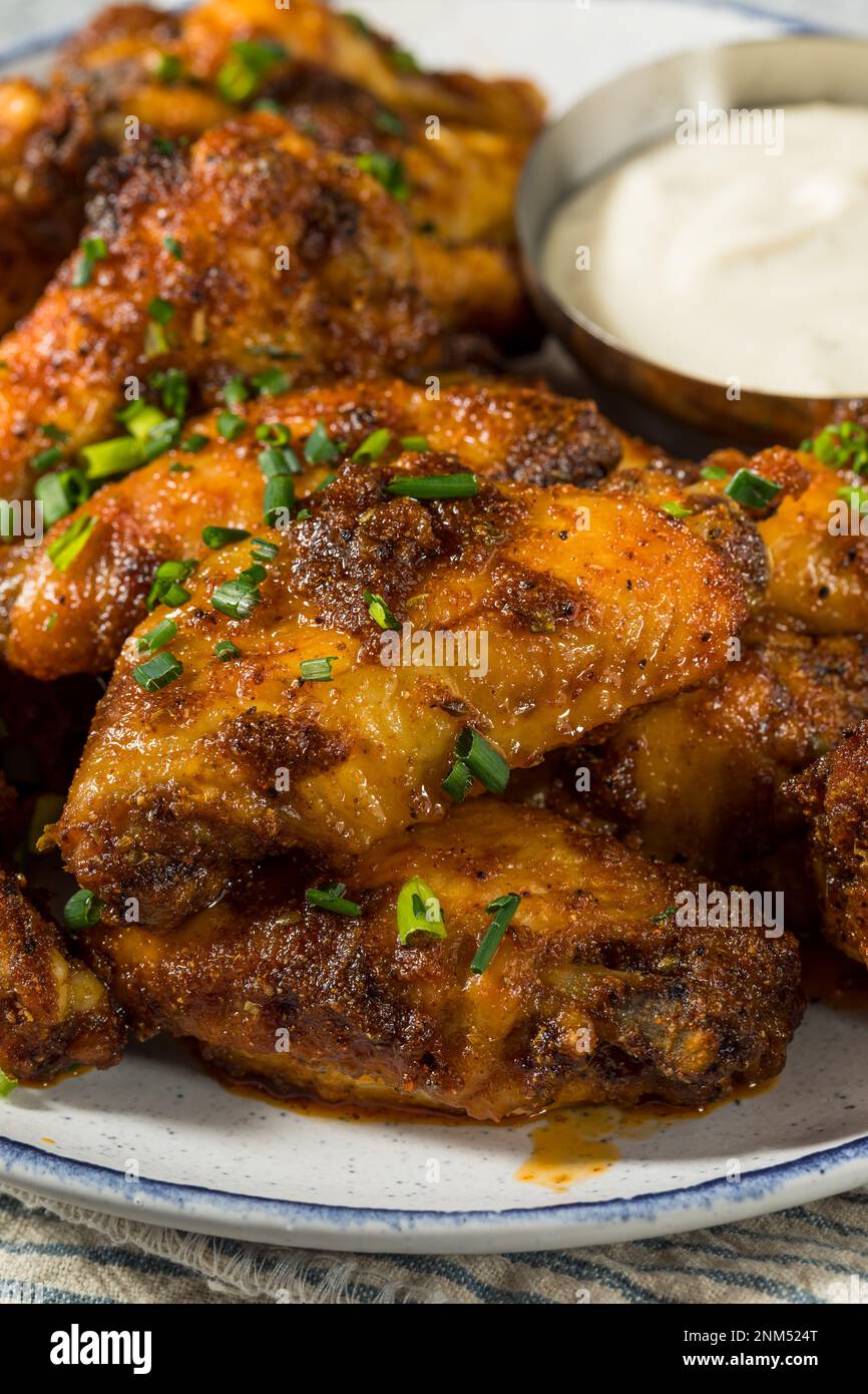 Homemade Nashville Hot Chicken Wings with Ranch Dressing Stock Photo
