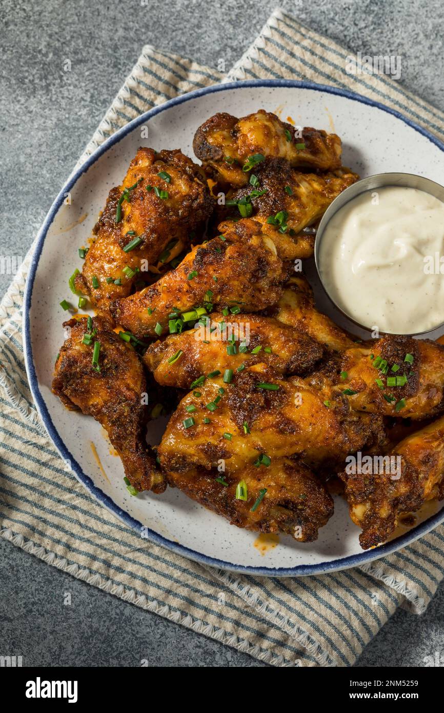 Homemade Nashville Hot Chicken Wings with Ranch Dressing Stock Photo