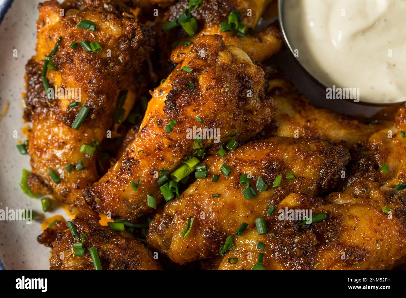 Homemade Nashville Hot Chicken Wings with Ranch Dressing Stock Photo
