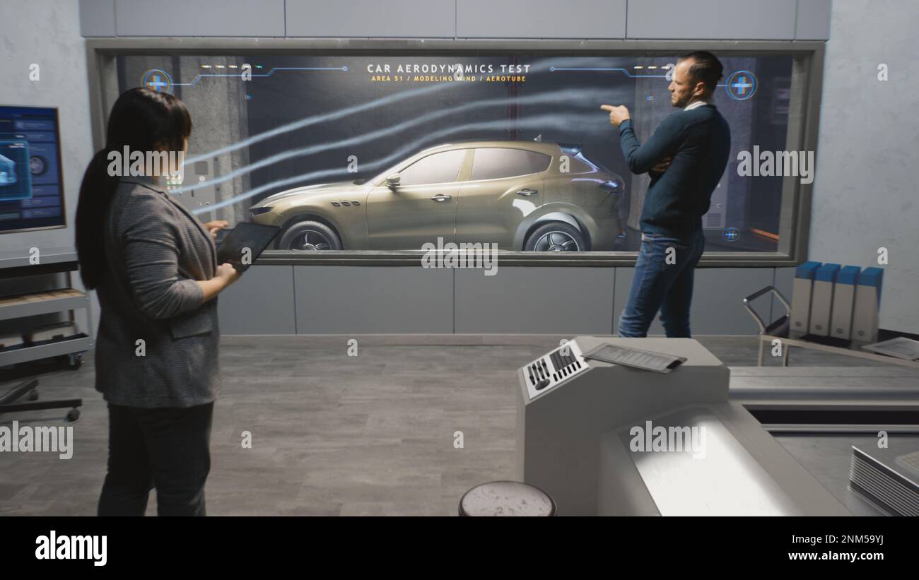 Engineers check aerodynamics of eco-friendly electric car in lab for modern modifications using wind tunnel with steam. Computer system for changing parameters. Car testing and technologies concept. Stock Photo