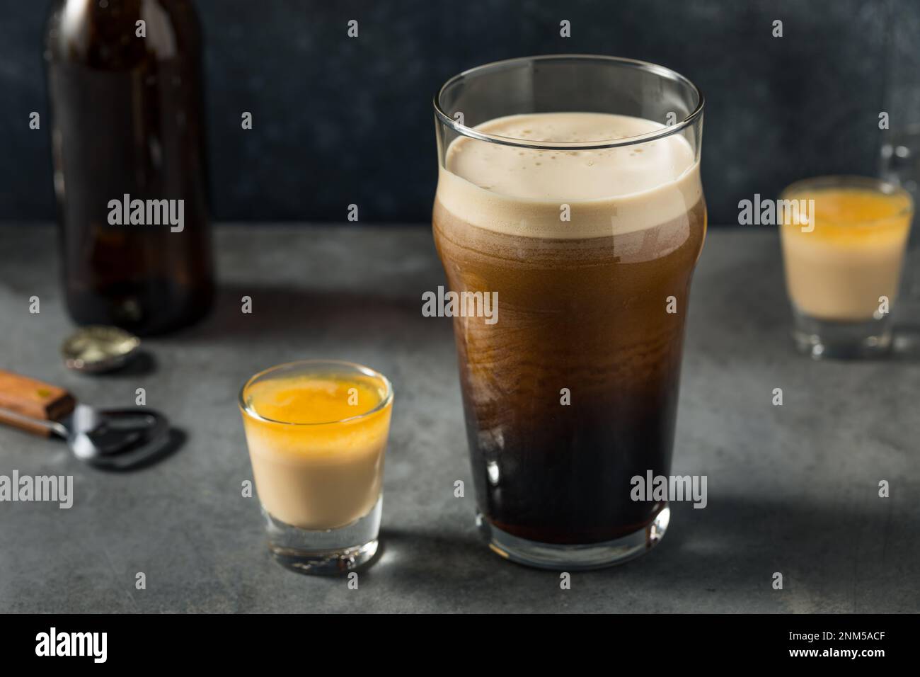 Boozy Irish Bomb Shot Cocktail with Stout Beer for St Patricks Day Stock Photo
