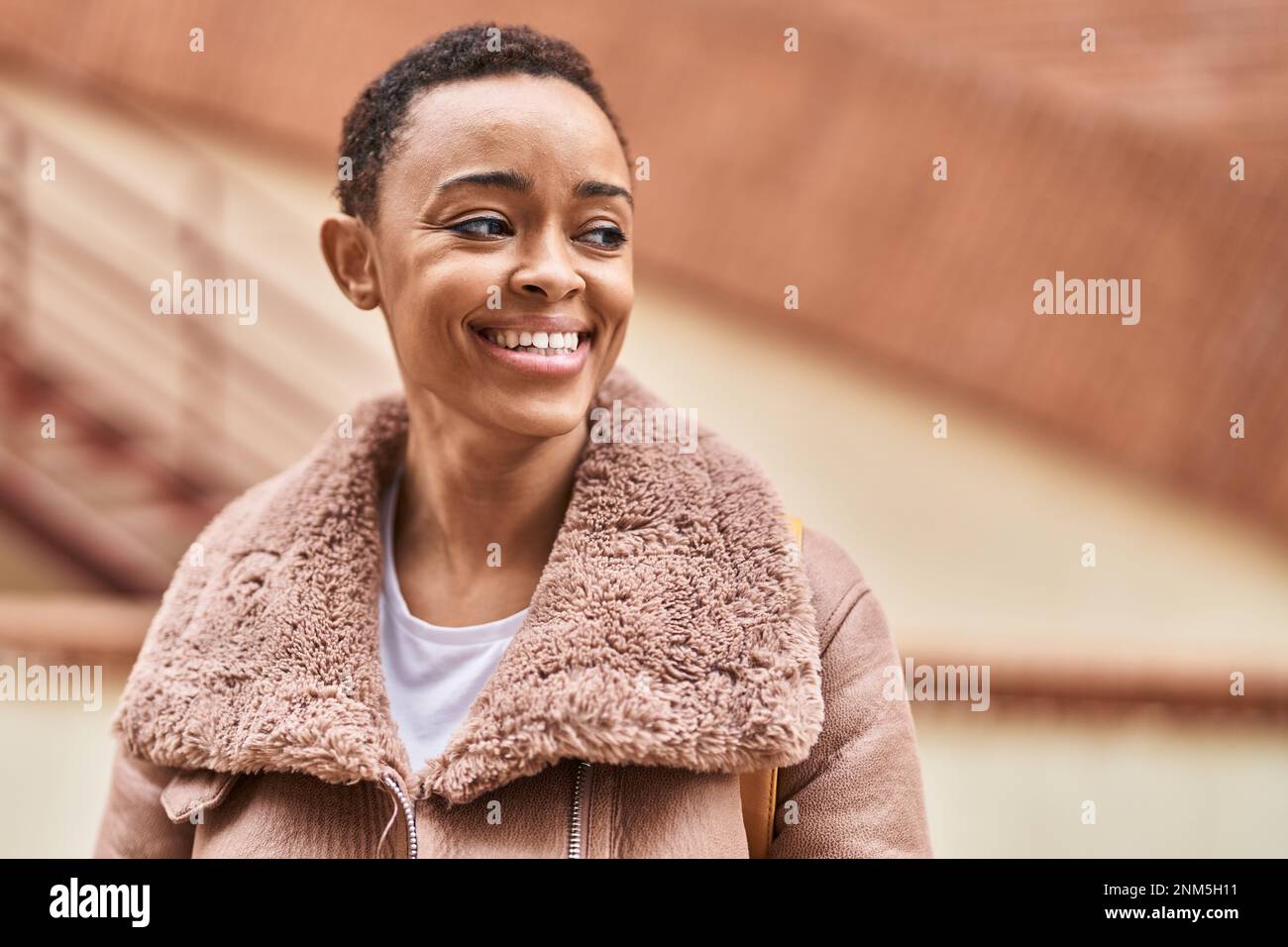African american woman smiling confident looking to the side at street ...