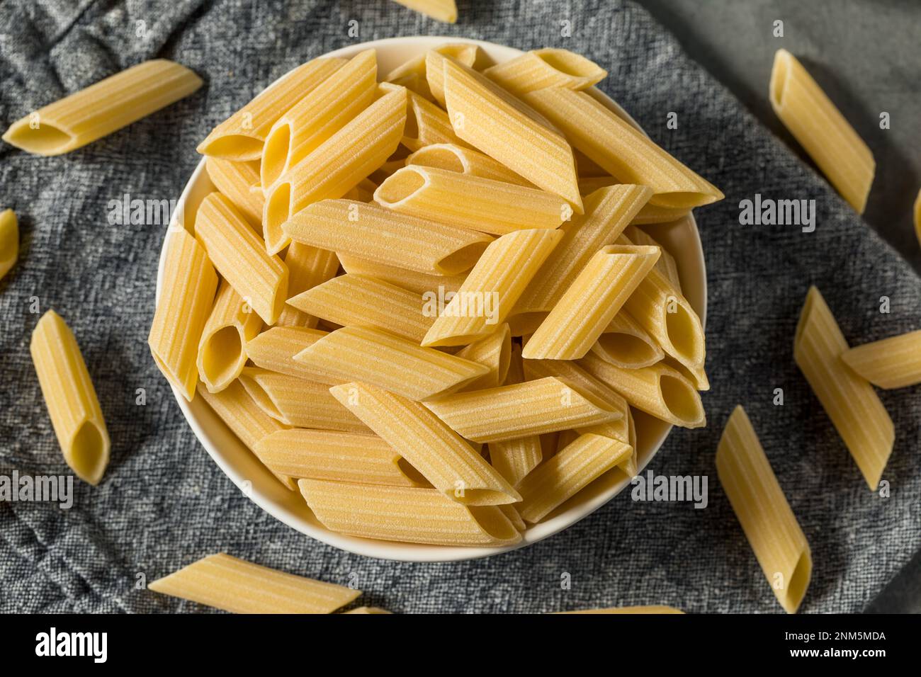 Pennony Raw Organic Pennoni Pasta in a Bowl Stock Photo - Alamy