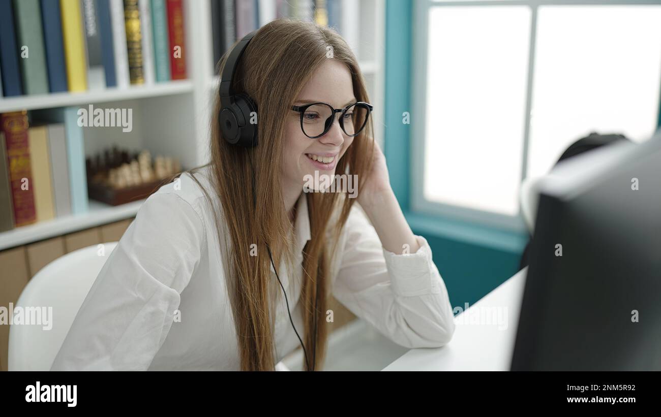 Blonde Computer Program Young blonde woman student using computer studying at university ...