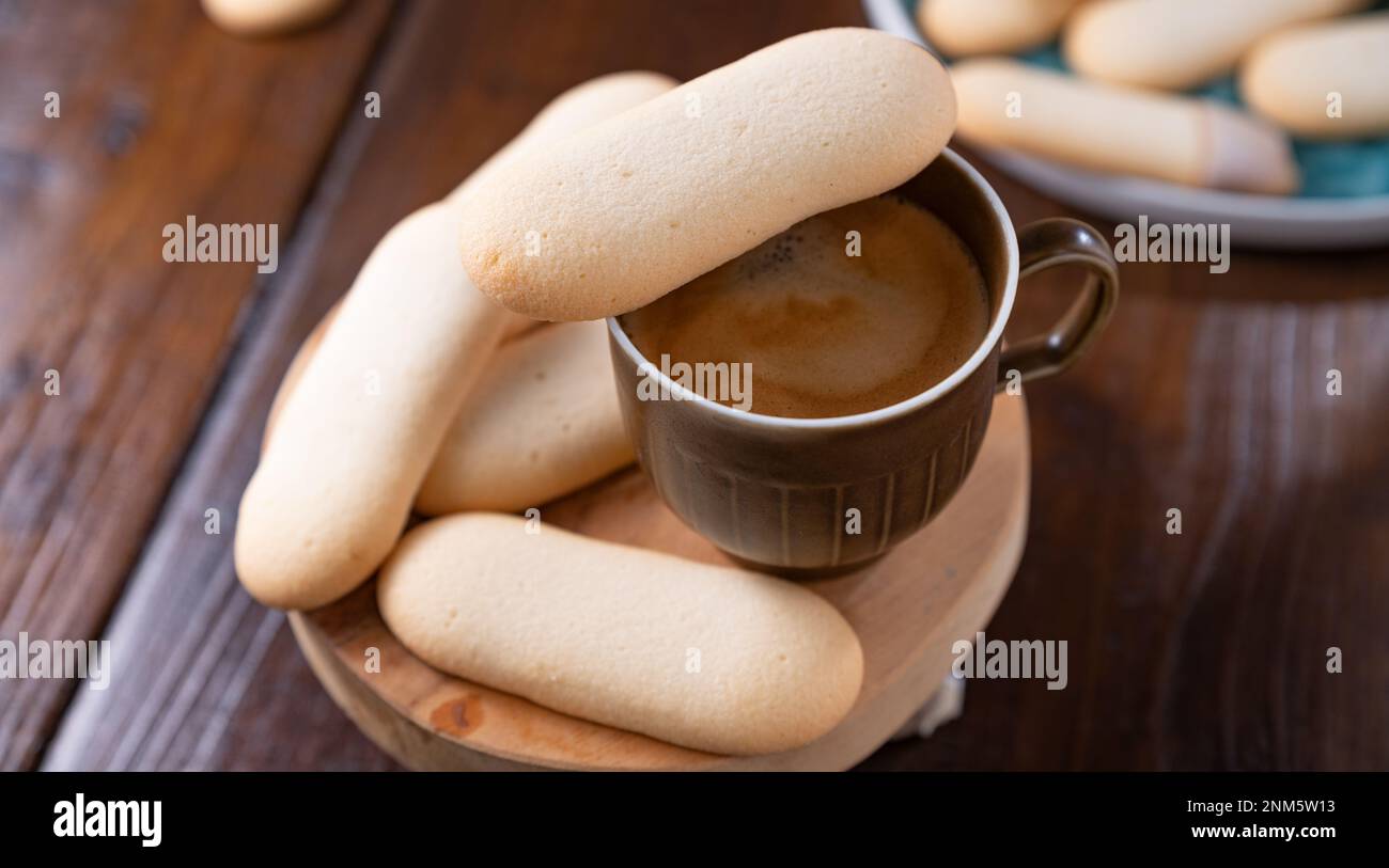 Cookies cat's tongue. Traditional Indonesian and Italian biscuit pastries. Dessert and espresso