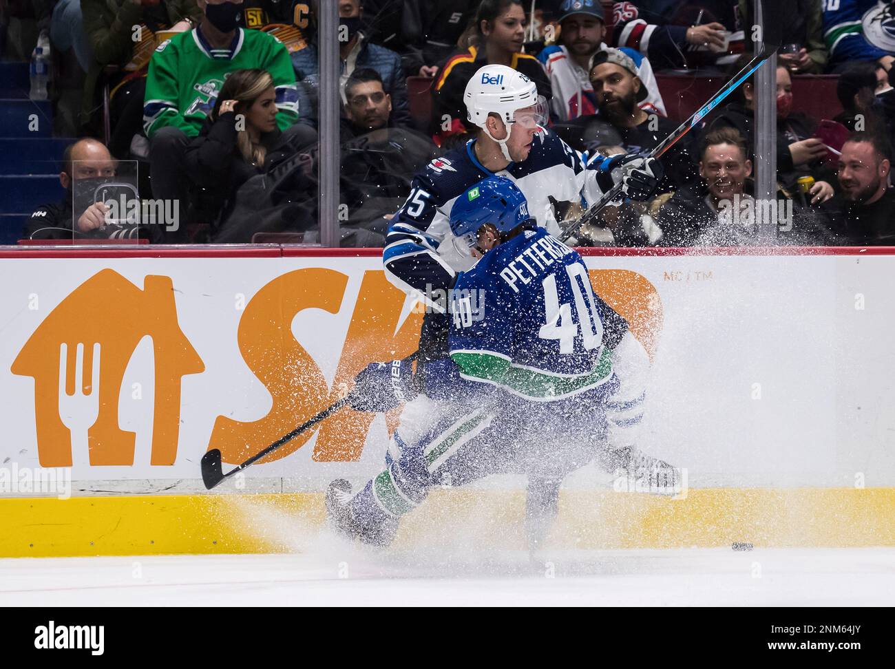 Winnipeg Jets' Paul Stastny, back, checks Vancouver Canucks' Elias  Pettersson during the second period of an NHL hockey game Friday, Dec. 10,  2021, in Vancouver, British Columbia. (Darryl Dyck/The Canadian Press via