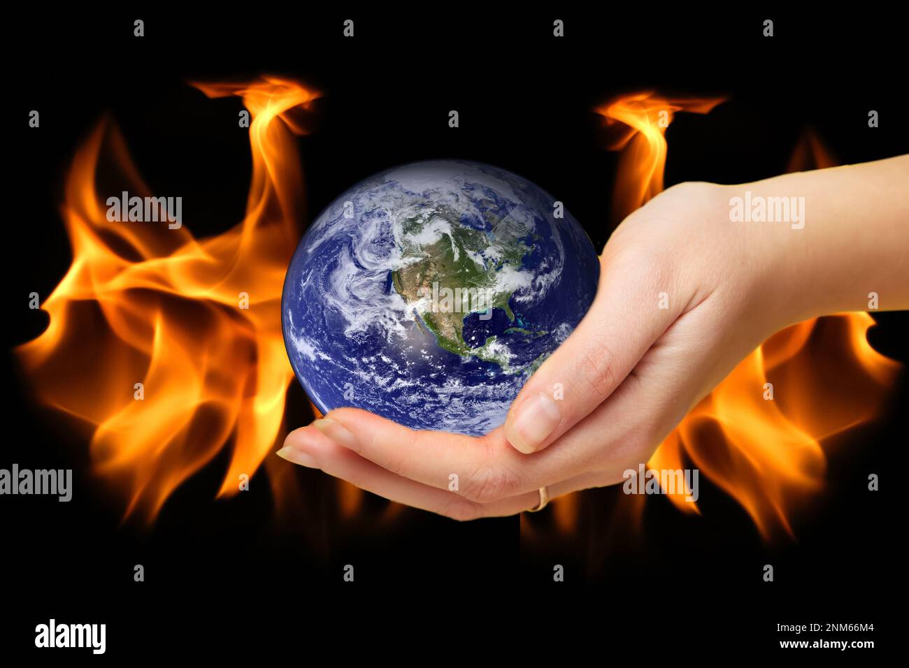 Burning world earth. Global catasrtophe concept. This image elements furnished by NASA. Apocalypse. Planet Earth in hand. Stock Photo