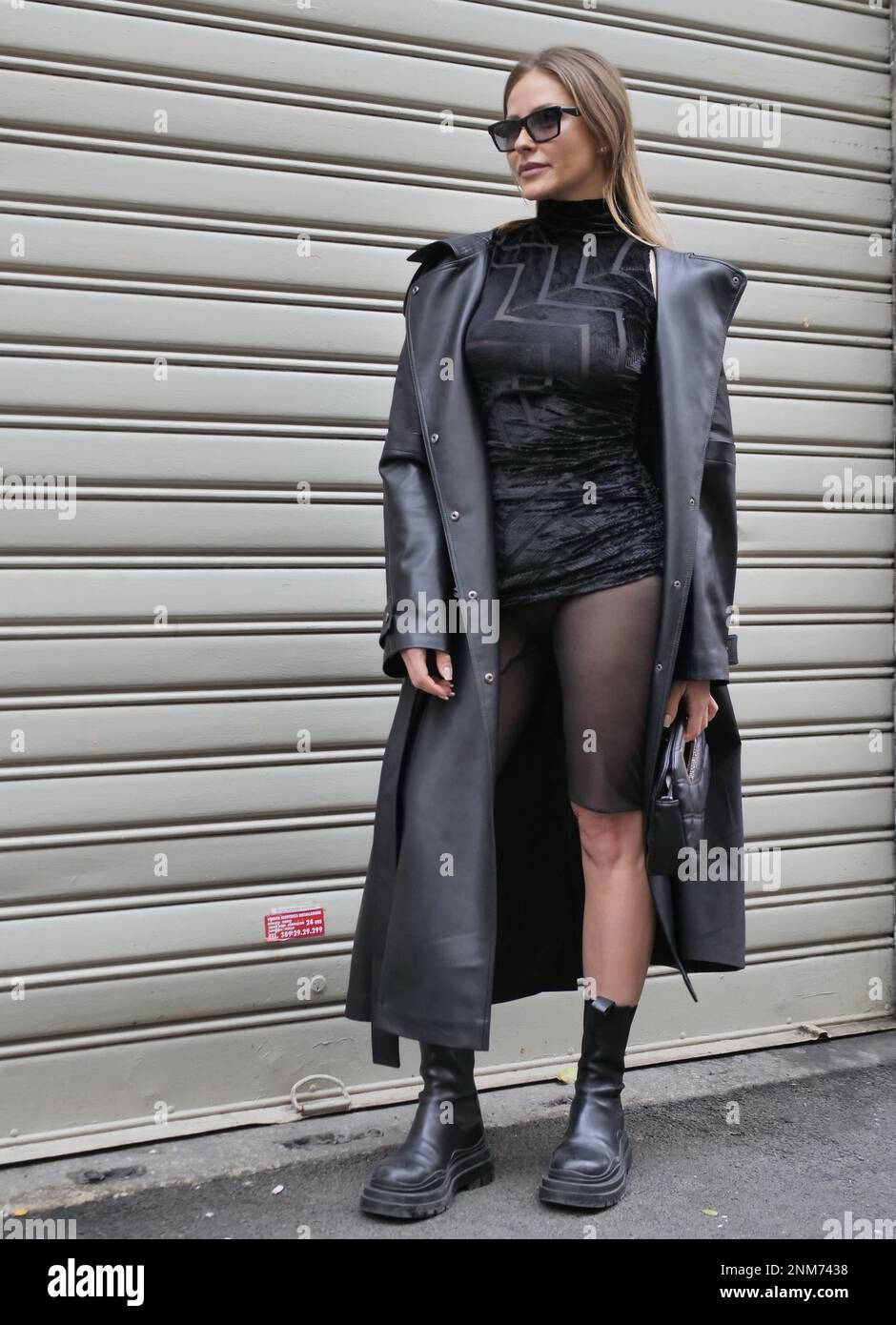 Milan Milan, . 24th Feb, 2023. Ginta Kubiliute with total black outfit,  long coat and mini dress in via Palermo in Milan Credit: Independent Photo  Agency/Alamy Live News Stock Photo - Alamy