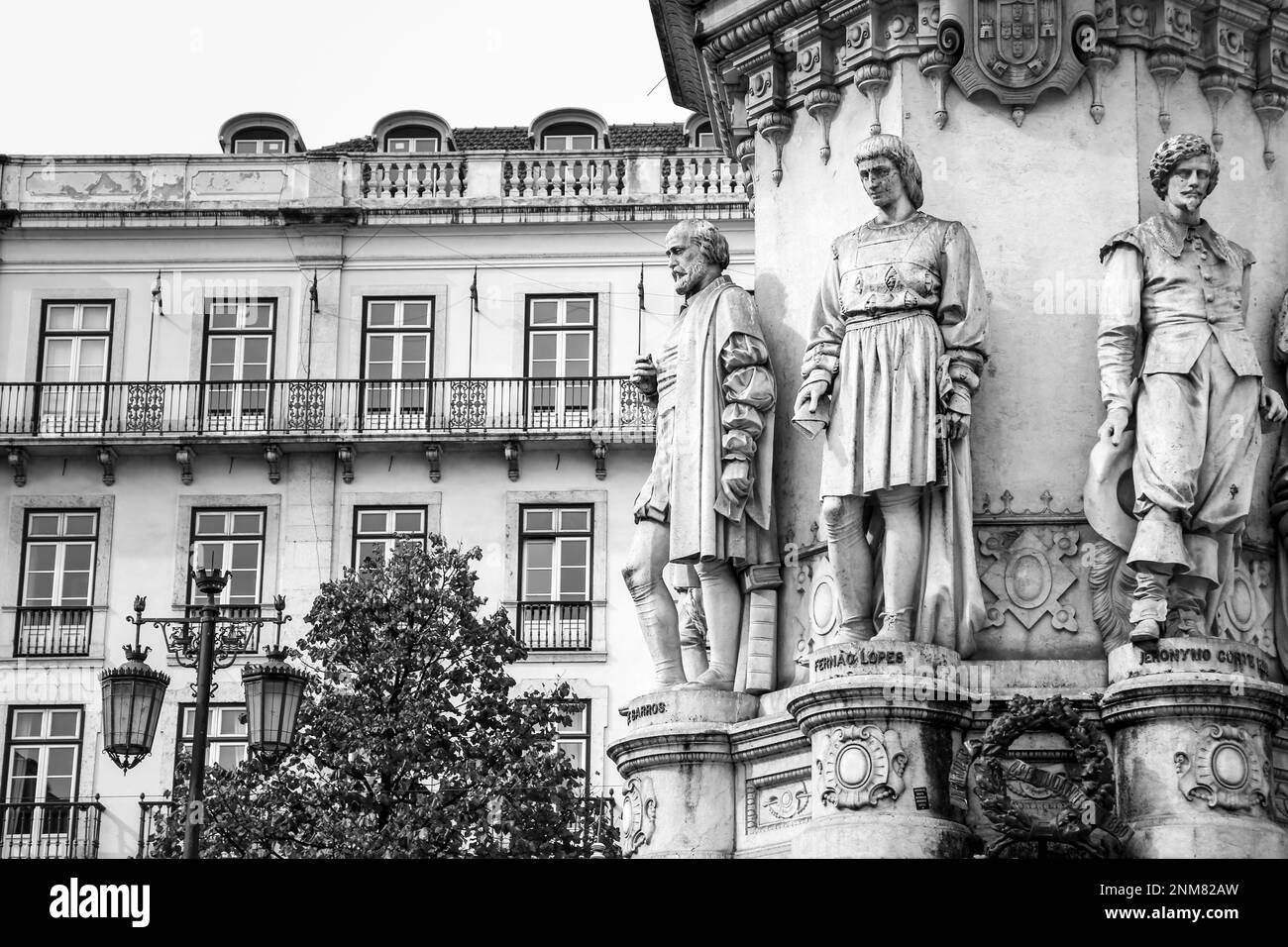 Lisbon, Portugal- November 4, 2022: Tall bronze statue of Luis de Camoes writer on a lioz limestone pillar in Camoes Square Stock Photo