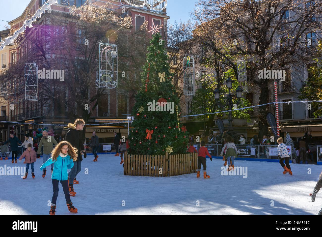 Granada, Spain; December18, 2022 Adults and children skating on an