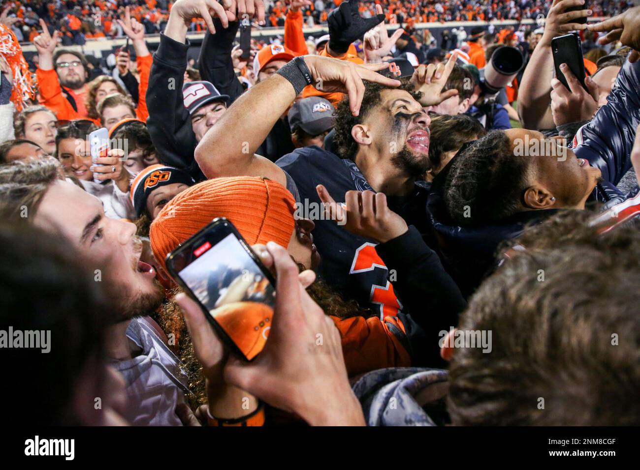 Oklahoma State quarterback Spencer Sanders (3) is surrounded by fans