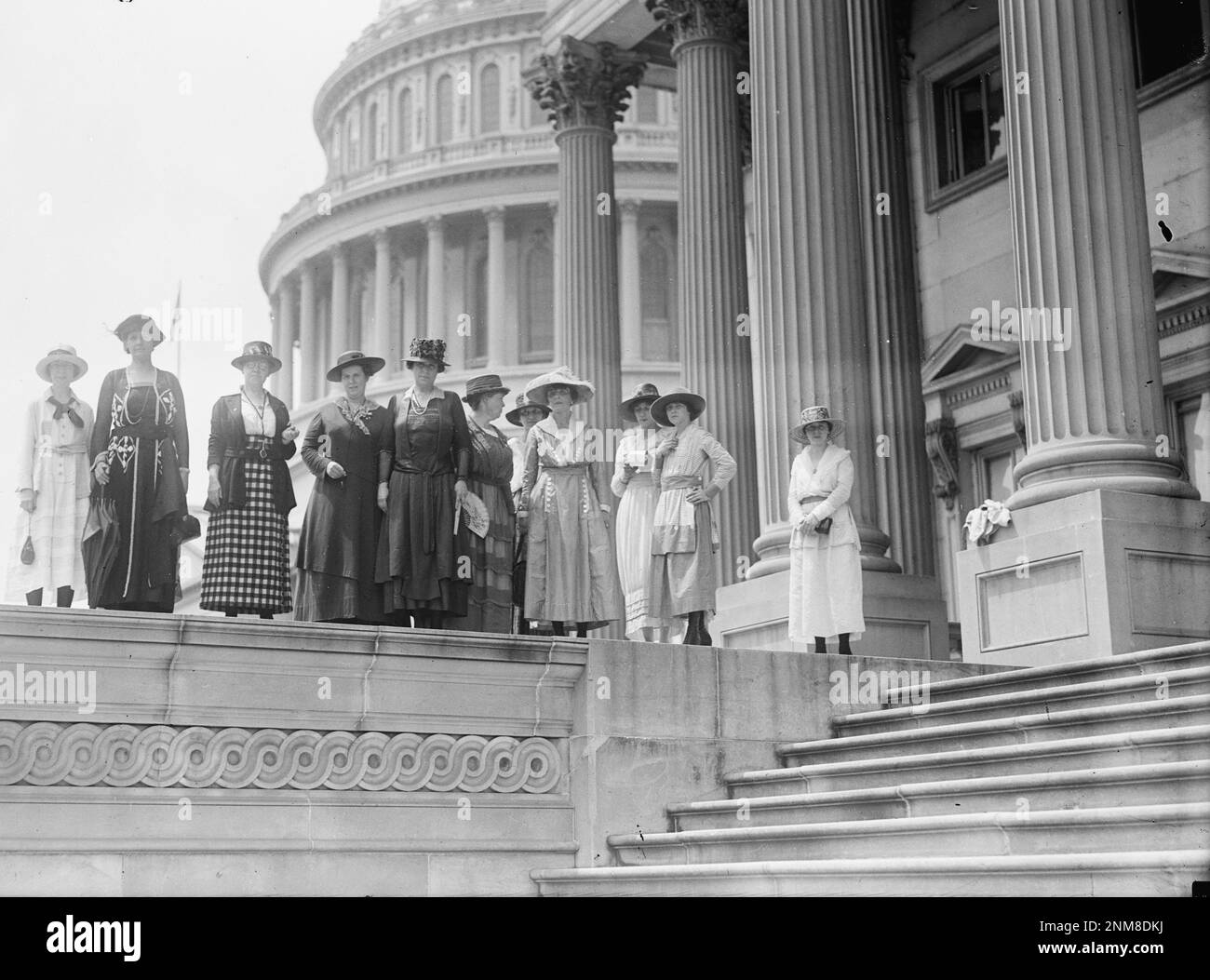 Members of the National Woman's Party Lobby Committee stand together outside the Capitol - 1919 Stock Photo