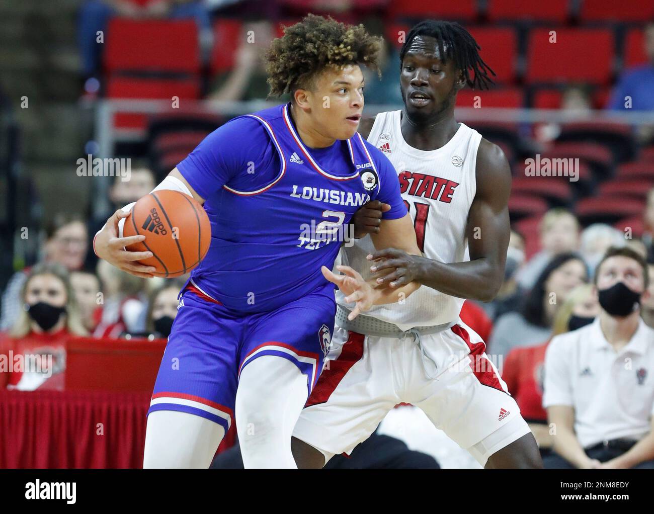 Louisiana Tech forwards Kenneth Lofton, Jr. (2) and Andrew Gordon (33)  celebrate a win over Mississippi after an NCAA college basketball game in  the NIT, Friday, March 19, 2021, in Frisco, Texas. (