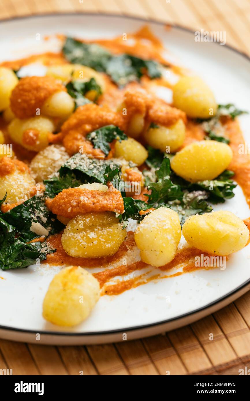 Gnocchi with Kale and Roasted Paprika Sauce Stock Photo - Alamy