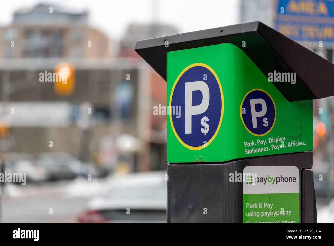 Ottawa, Canada - January 23, 2023: Parking meter on city street. Pay by phone available Stock Photo