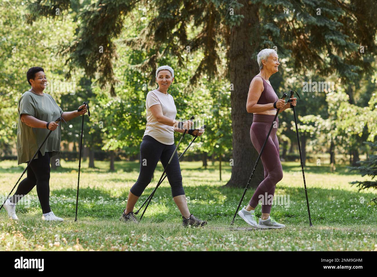 Senior woman walking in park hi-res stock photography and images - Alamy