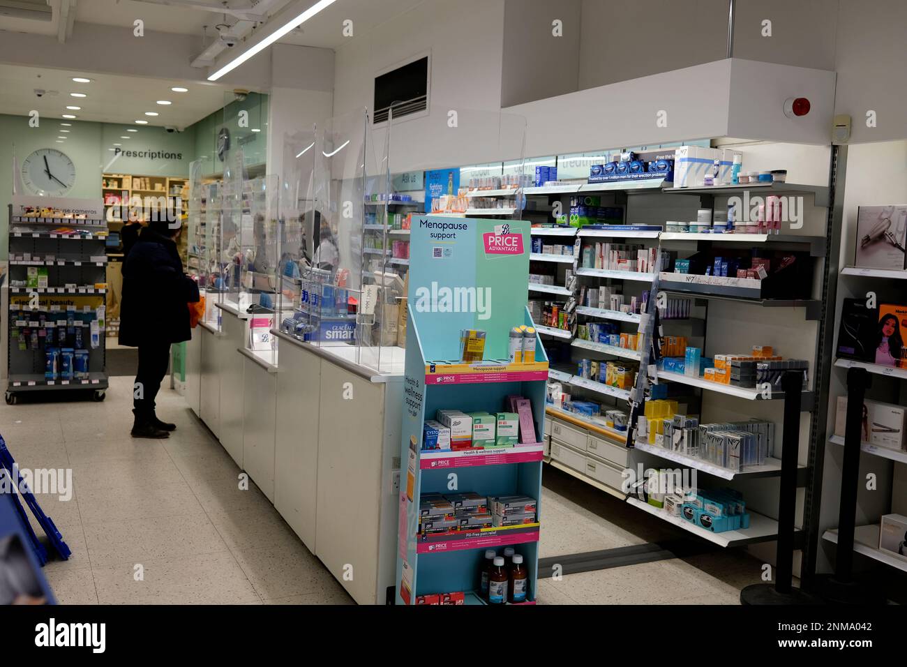 customers at prescription counter in boots chemist,whitstable town,east kent,uk february 2023 Stock Photo