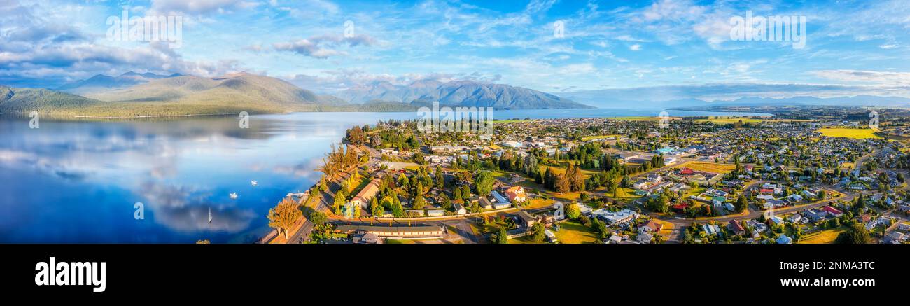 Lake Te Anau and Te Anau town in Fiordland of New Zealand - wide aerial panorama of Gateway to Milford Sound. Stock Photo