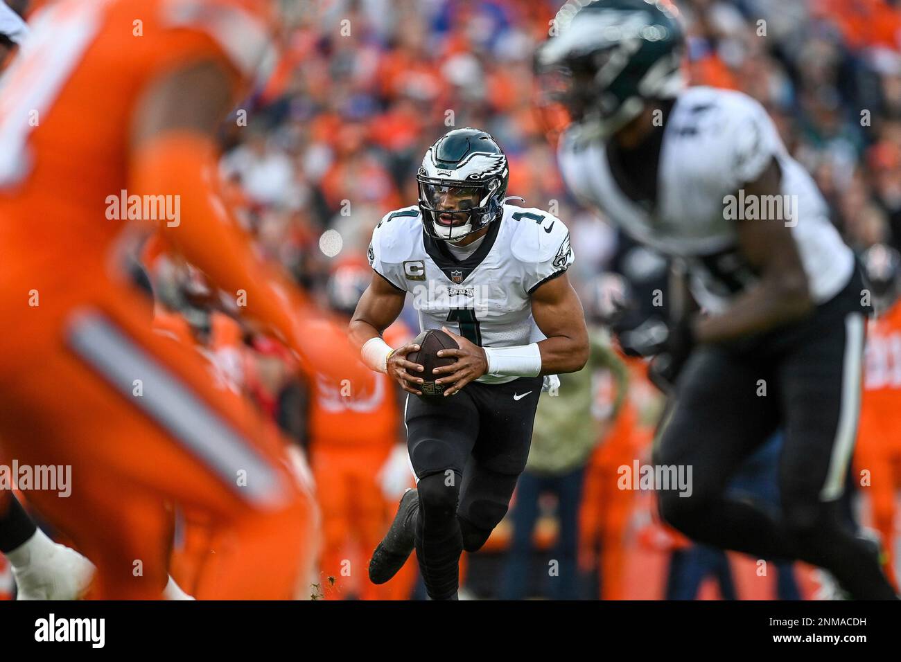 DENVER, CO - NOVEMBER 14: Philadelphia Eagles quarterback Jalen Hurts (1)  carries the ball on a rushing play during a game between the Denver Broncos  and the Philadelphia Eagles at Empower Field