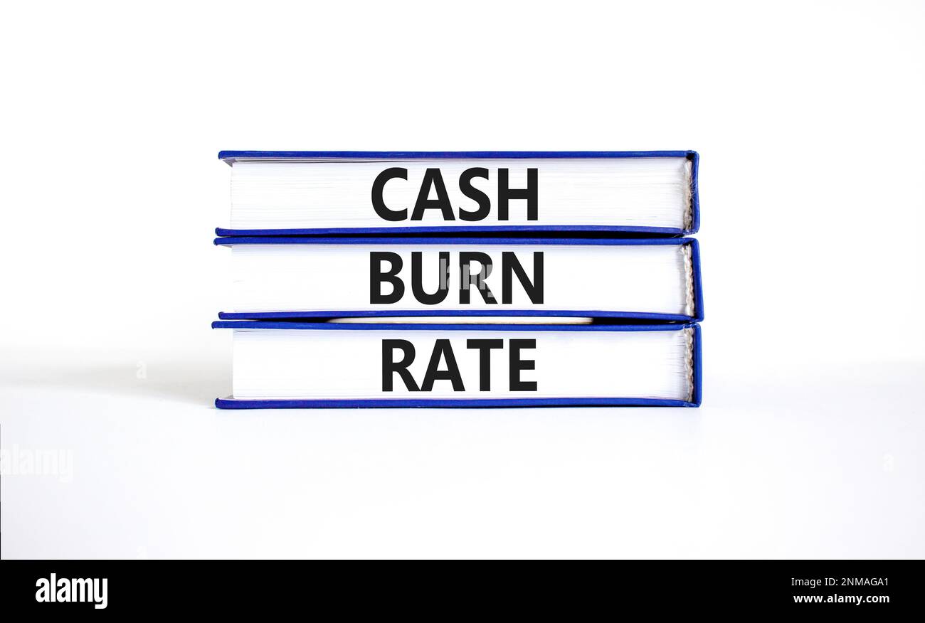 Cash burn rate symbol. Concept words Cash burn rate on books on a