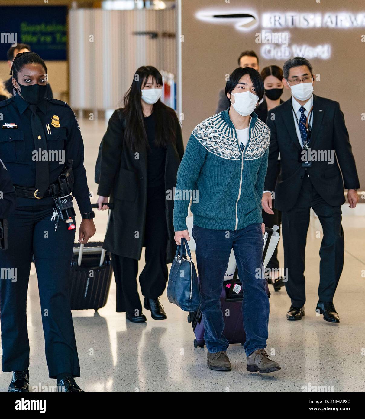 BTS arrive at JFK Airport in NY wearing face masks ahead of New