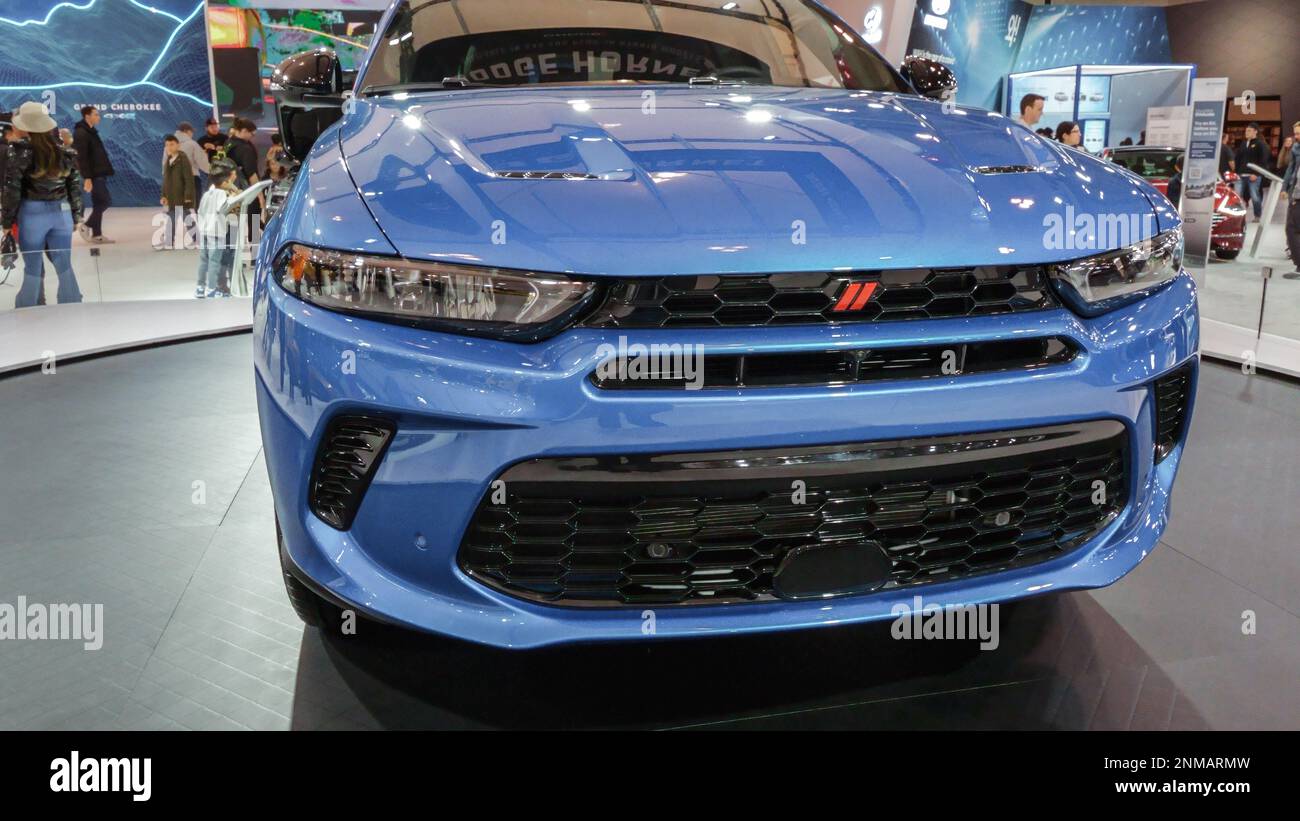 Blue Dodge car on display. Crowds looking at new car models at Auto show. National Canadian Auto Show with many car brands. Toronto ON Canada Feb 19, Stock Photo