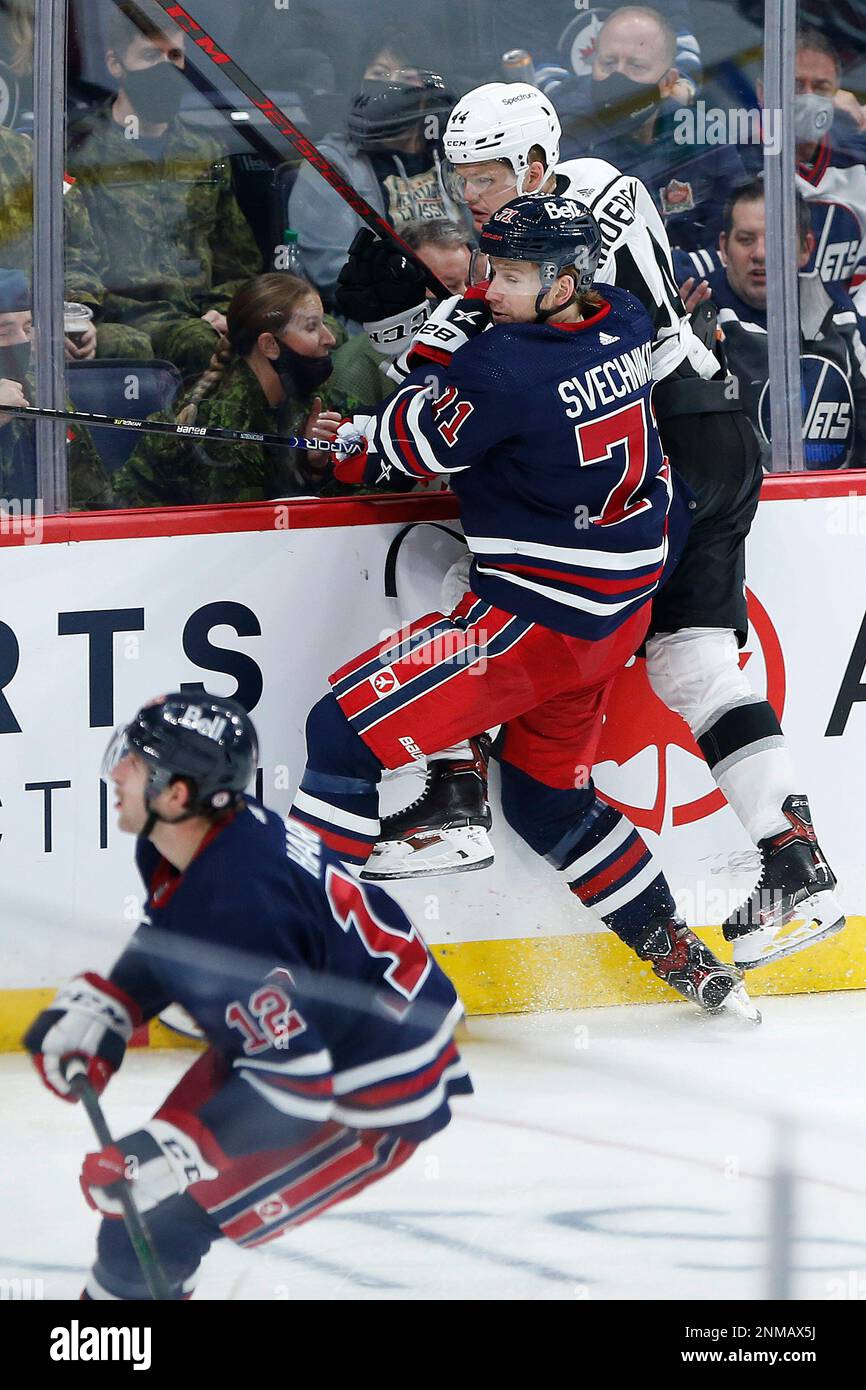 Winnipeg Jets' Evgeny Svechnikov (71) and Los Angeles Kings' Mikey ...