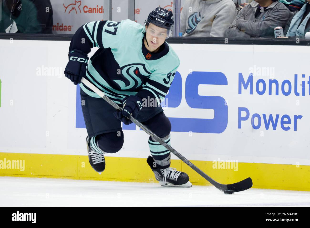 Seattle Kraken center Yanni Gourde (37) skates with the puck against