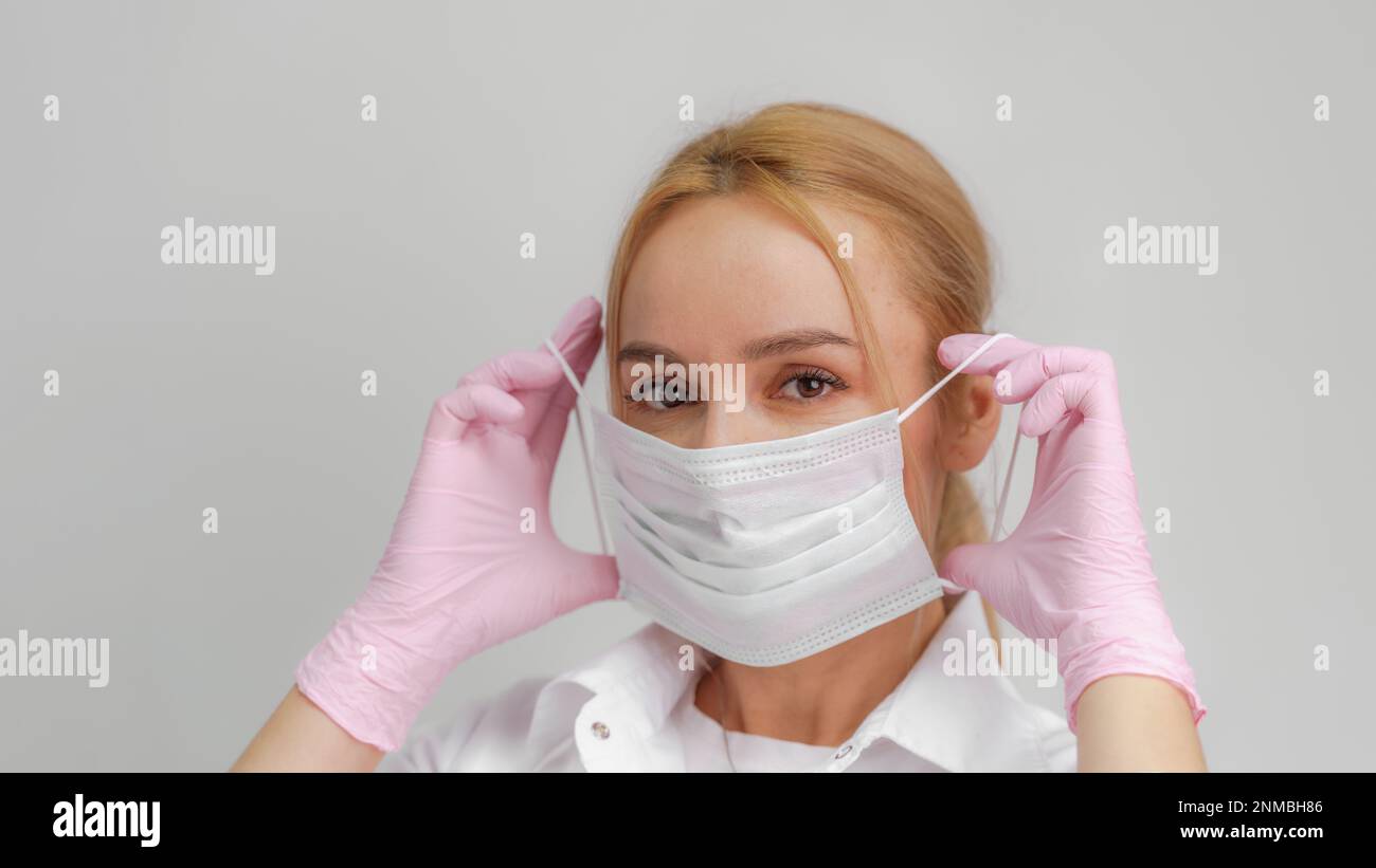 Professional puts face mask woman hi-res stock photography and images ...
