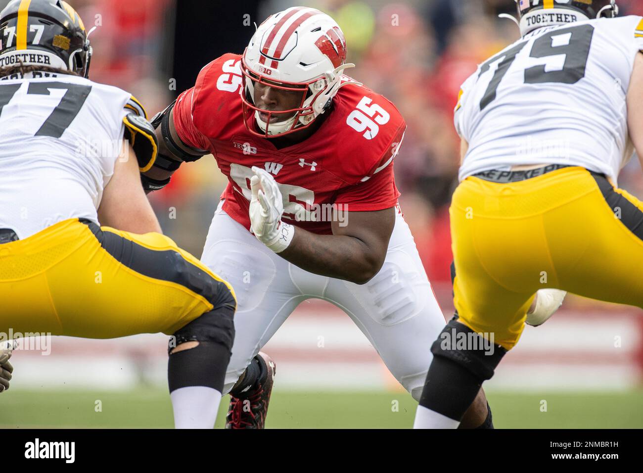 Wisconsin Badgers defensive lineman Keeanu Benton (95) lines up during