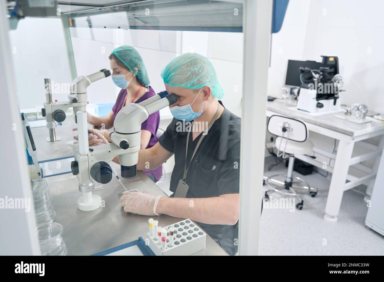 Man and a woman work in a modern laboratory Stock Photo - Alamy