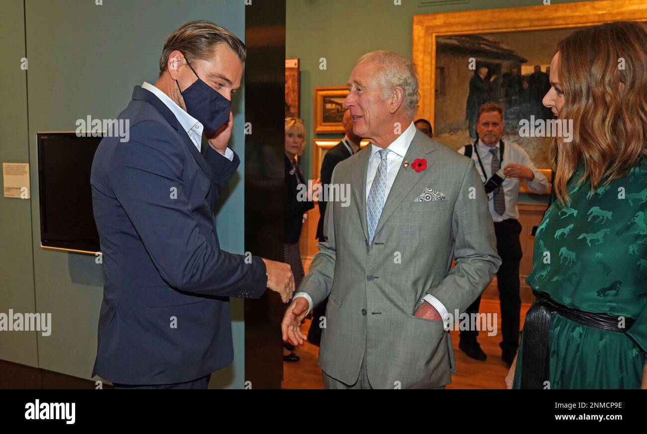 Britain's Prince Charles, center, speaks with designer Stella McCartney