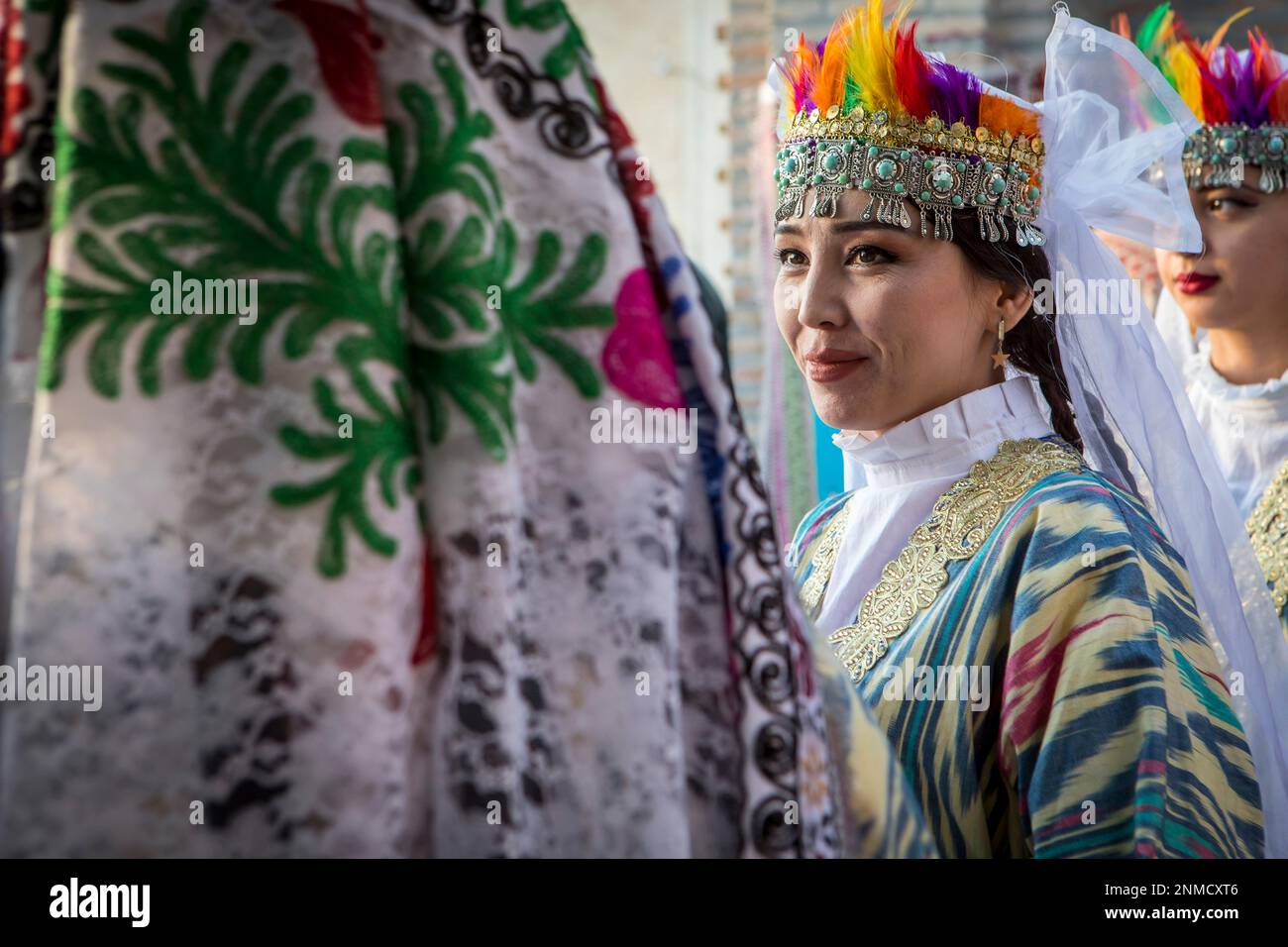 women in traditional dress, for folk dance, dancer, in Rukhobod Mausoleum, Samarkand, Uzbekistan Stock Photo