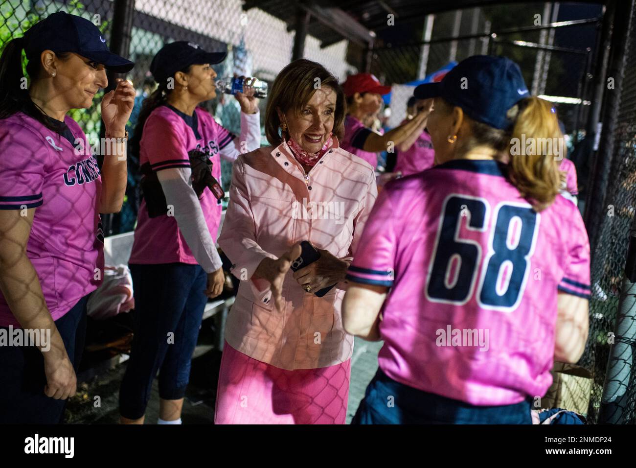 UNITED STATES - OCTOBER 27: Speaker of the House Nancy Pelosi, D-Calif., greets Rep. Kim Schrier, D-Wash., right, and members of the Congress team before the Congressional Women's Softball game that pits Congresswomen against female journalists at Watkins Recreation Center on Capitol Hill on Wednesday, October 27, 2021. (Photo By Tom Williams/CQ Roll Call via AP Images) Stock Photo